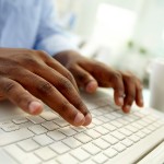 bigstock-Close-up-of-African-man-typing-31171979
